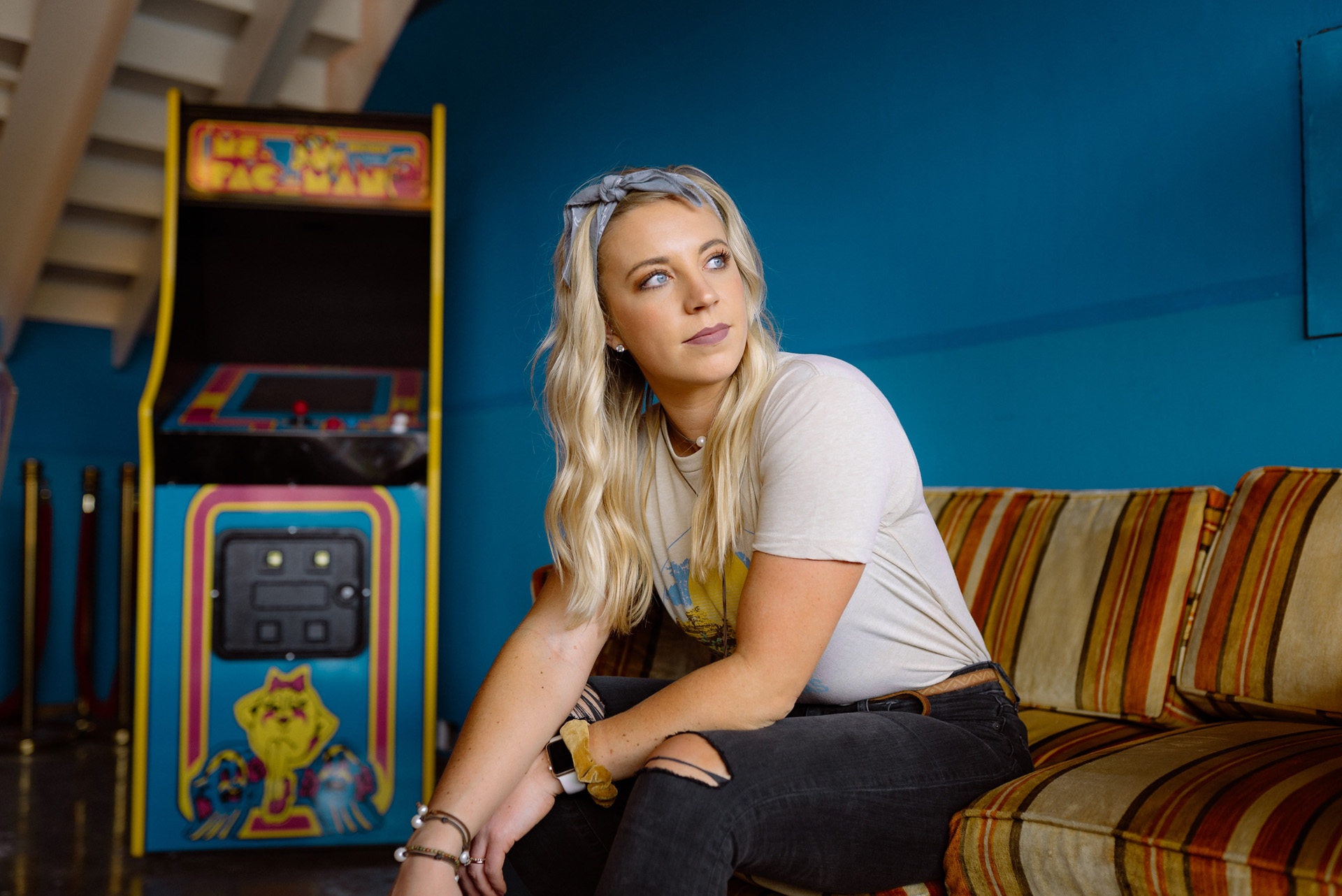 Woman beside a rented Pacman machine